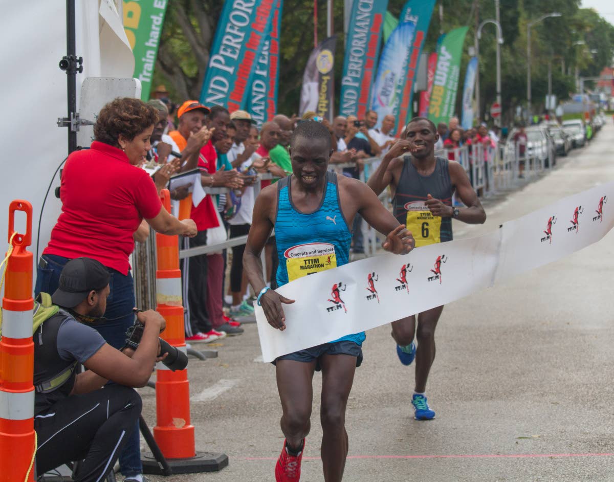 Kenyan brothers grab gold, silver in TT Intl Marathon