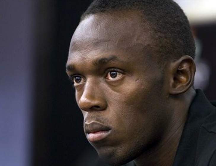 Bolt weeps at friend Mason's funeral