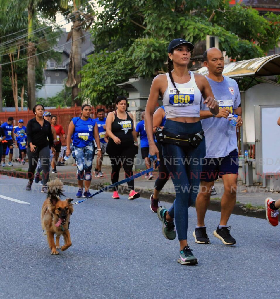 Cross Country & Road Race : Runner and dog, RBC Race for the Kids, Queen's Park Savannah, POS